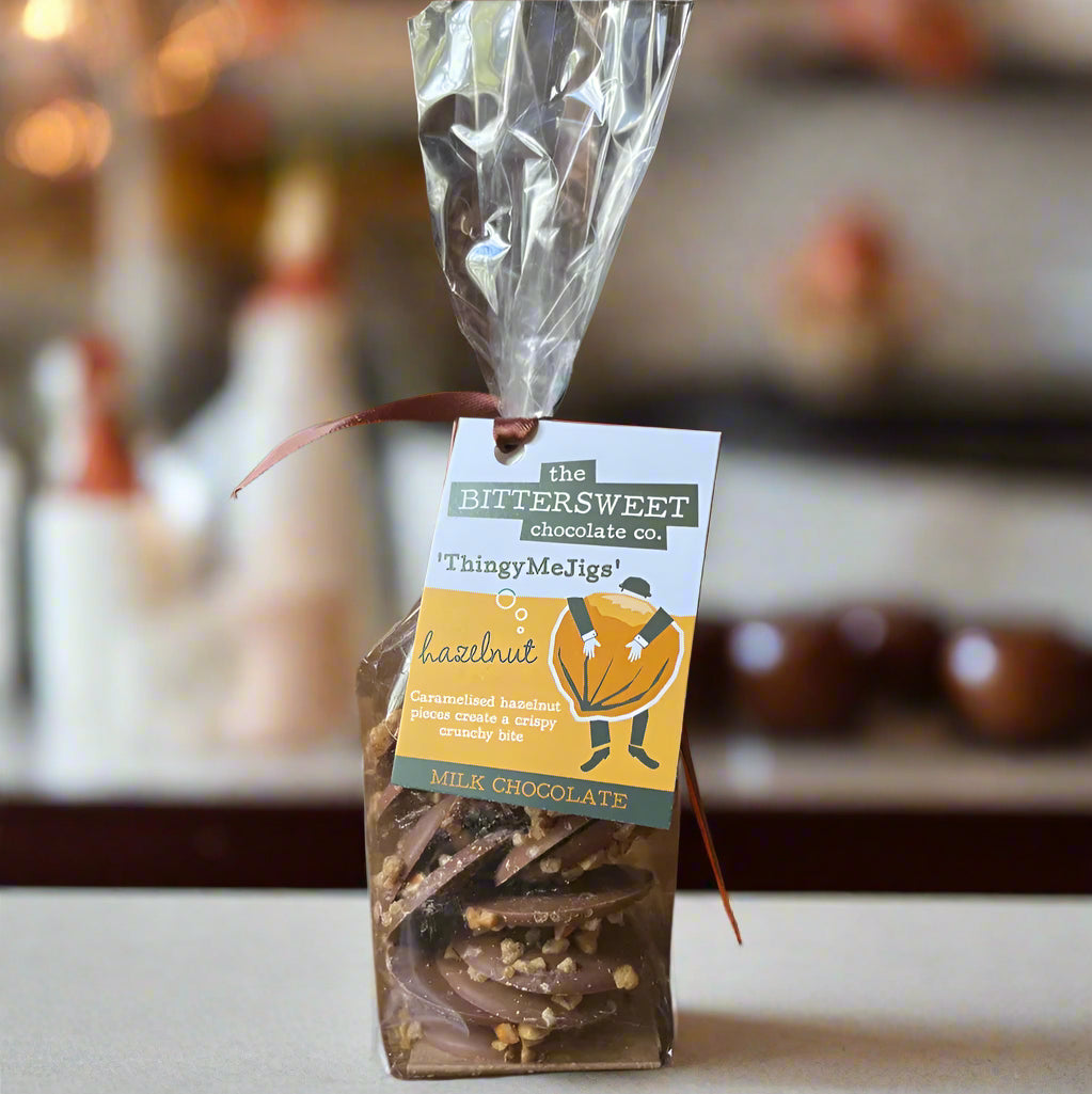 Packaged chocolate treat with a label on a wooden surface