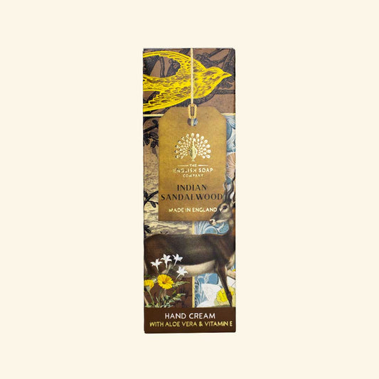 Hand cream packaging with a tag featuring Indian Sandalwood branding on a white background