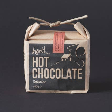 Box of hot chocolate with a rustic design on a dark background