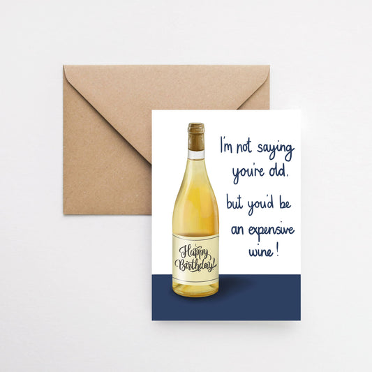 Birthday card with a bottle of wine illustration and humorous text, featuring a brown envelope.