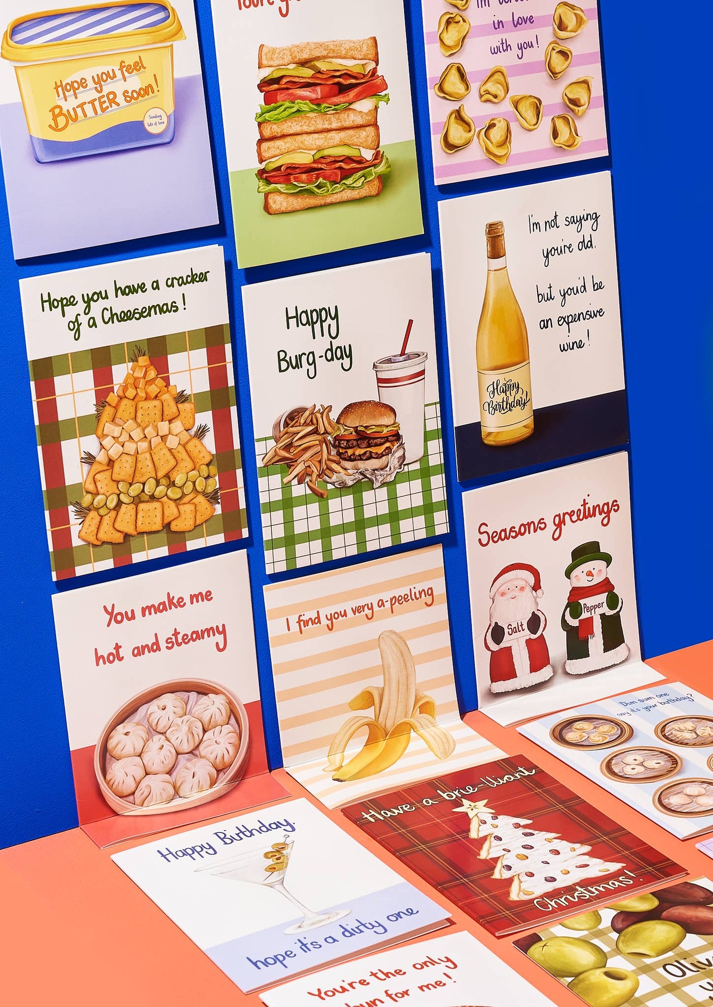 Collection of greeting cards with various designs on a blue background
