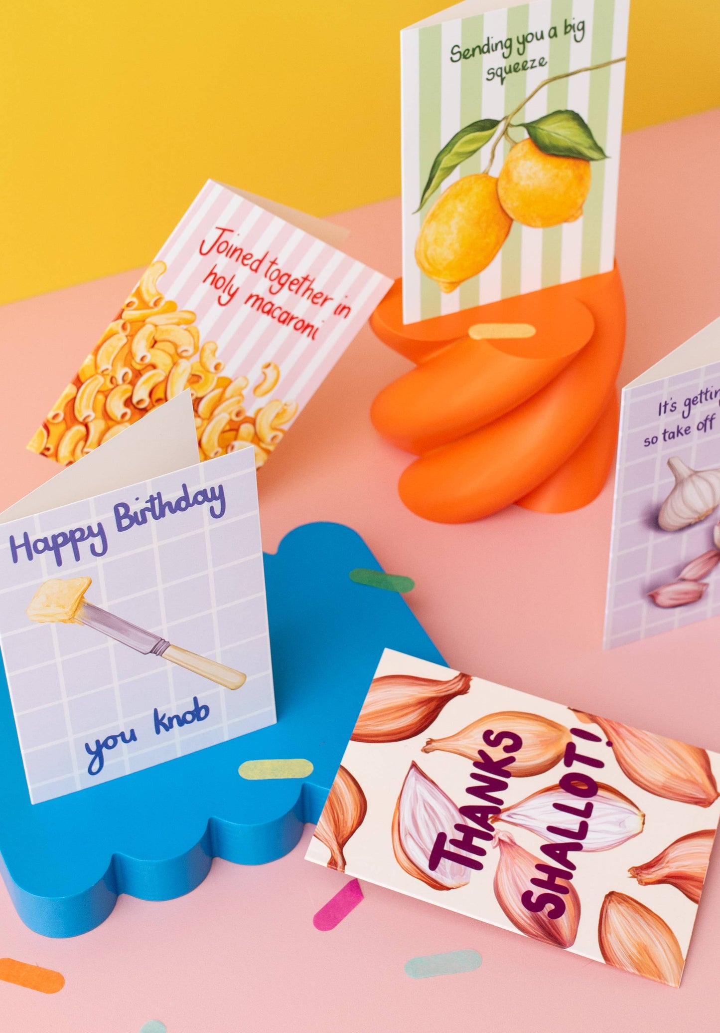Collection of humorous greeting cards with various designs on a colorful background