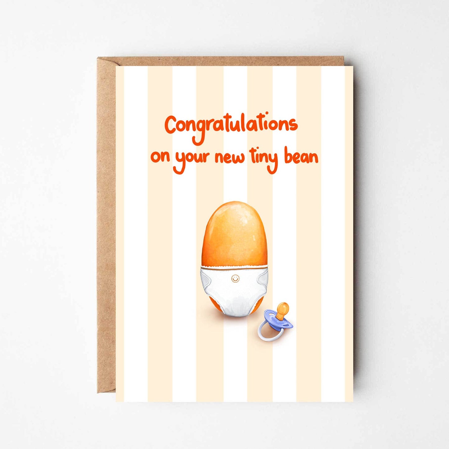 Greeting card with a baby pacifier and egg illustration on a striped background