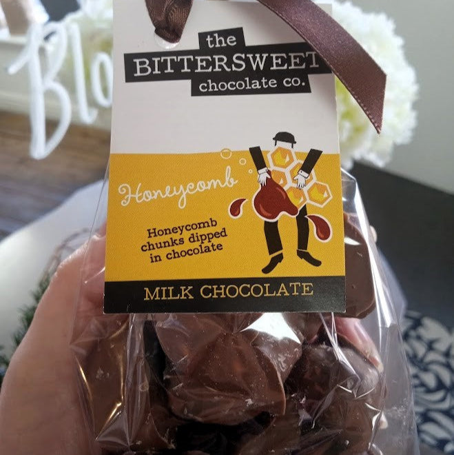 Packaged milk chocolate honeycomb chunks with Bittersweet Chocolate Co. label.