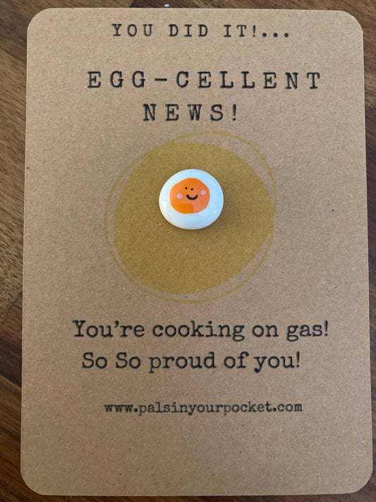 Card with an egg illustration and text on a brown background