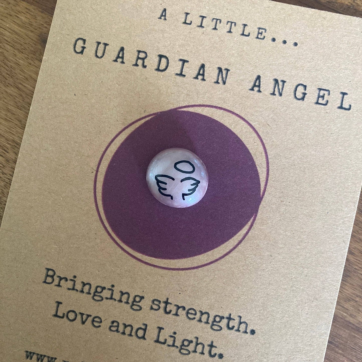 Guardian angel token on a brown card with text
