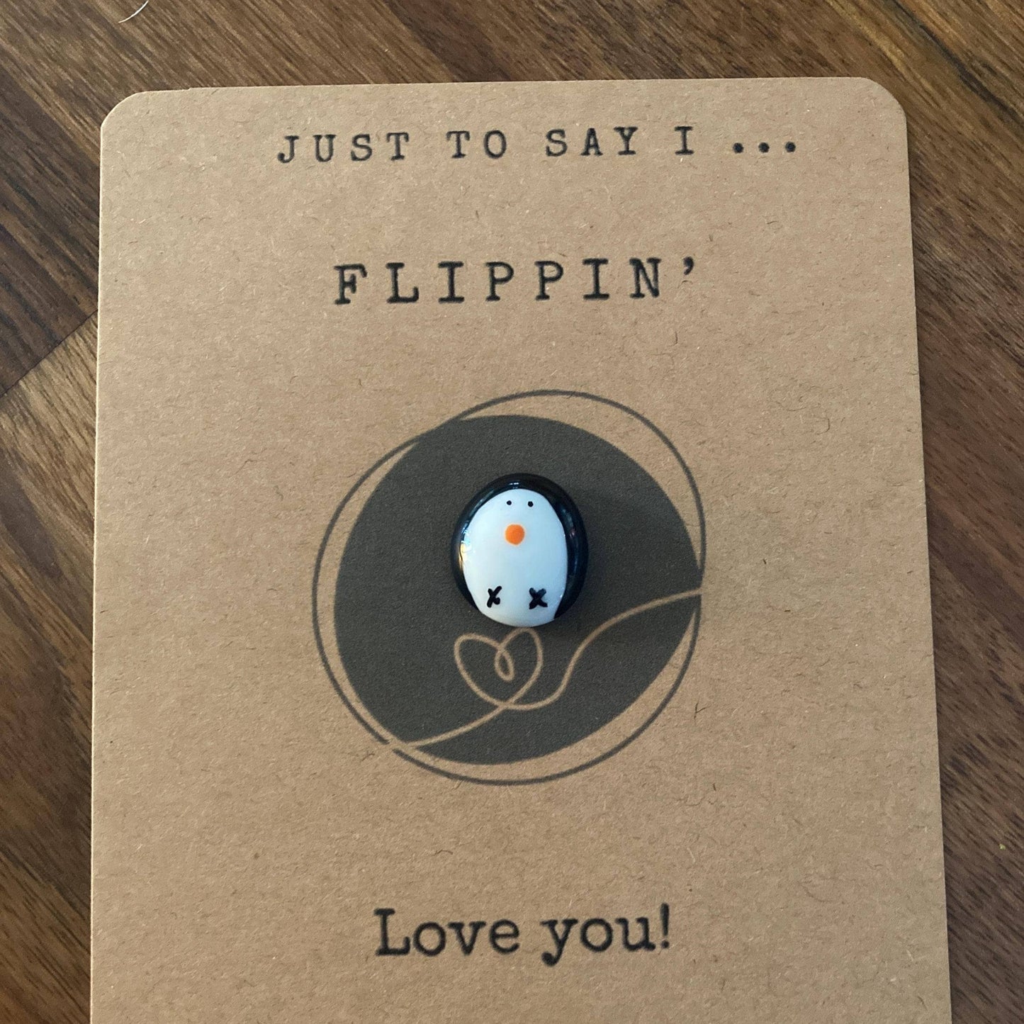 Penguin token on kraft card with Flippin' Love you wording