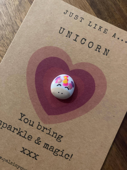 Unicorn-themed token on a card with text about sparkle and magic