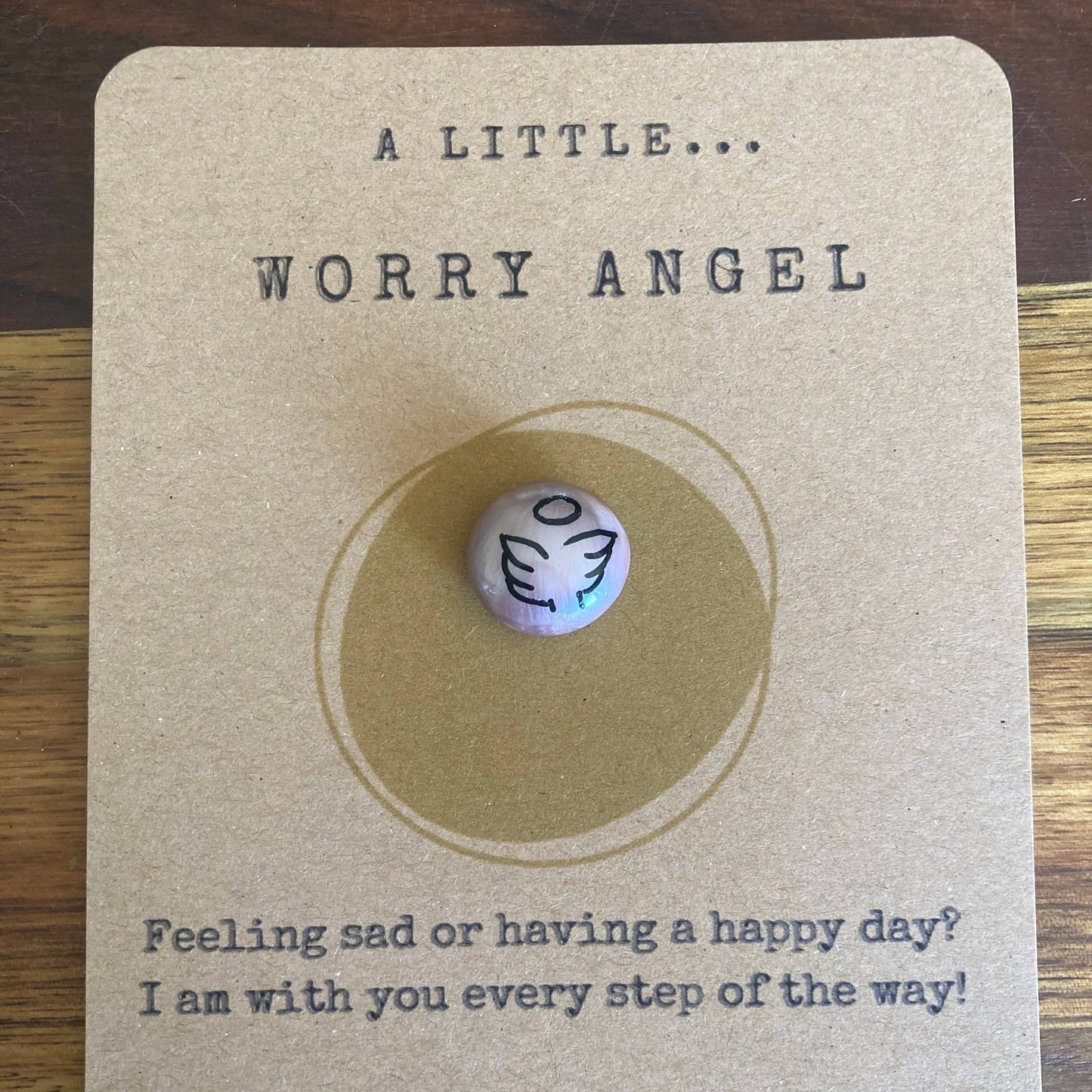 Worry bead on a card with text