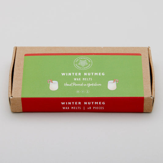 Box of winter nutmeg wax melts with a green label on a white background