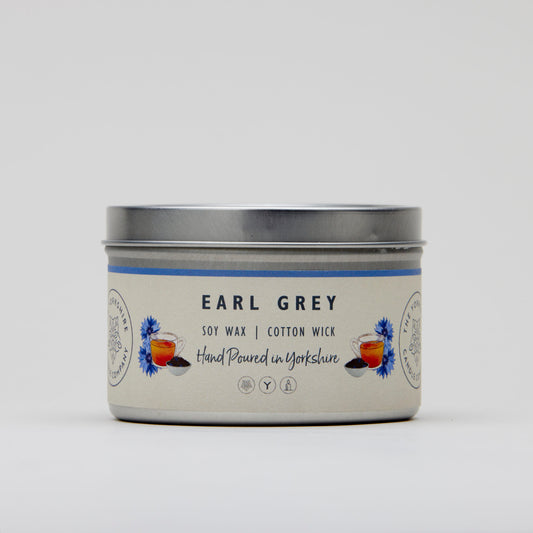 Candle tin labeled 'Earl Grey' with a white background