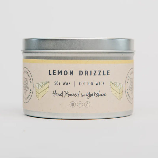 Candle tin labeled 'Lemon Drizzle' with a white background