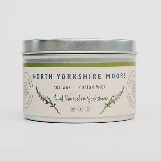 Candle tin labeled 'North Yorkshire Moors' with a decorative label on a white background