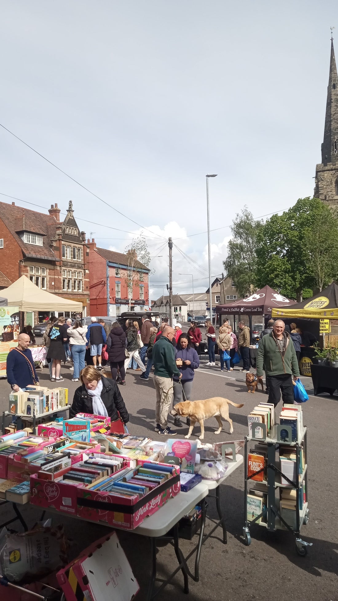 Kegworth Market Place on Sunday 17th May, with stalls and shoppers enjoying a busy market morning