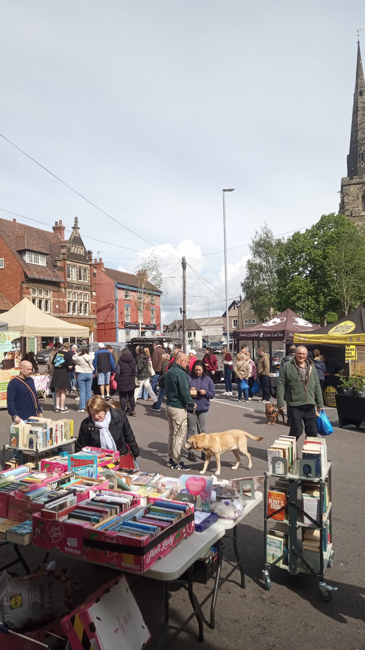 Kegworth Market Place on Sunday 17th May, with stalls and shoppers enjoying a busy market morning