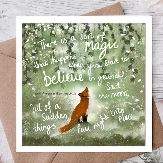 Card with a fox in a forest and motivational quote on a wooden surface