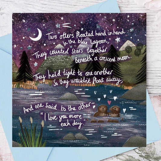 Greeting card with a romantic scene of two bears by a lake under a starry sky, with text.