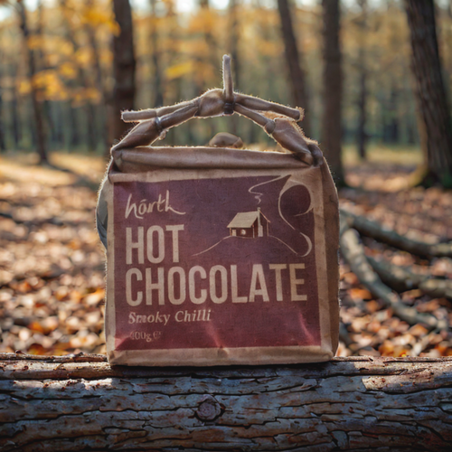 Hot chocolate package with 'smoky chilli' flavor in a forest setting