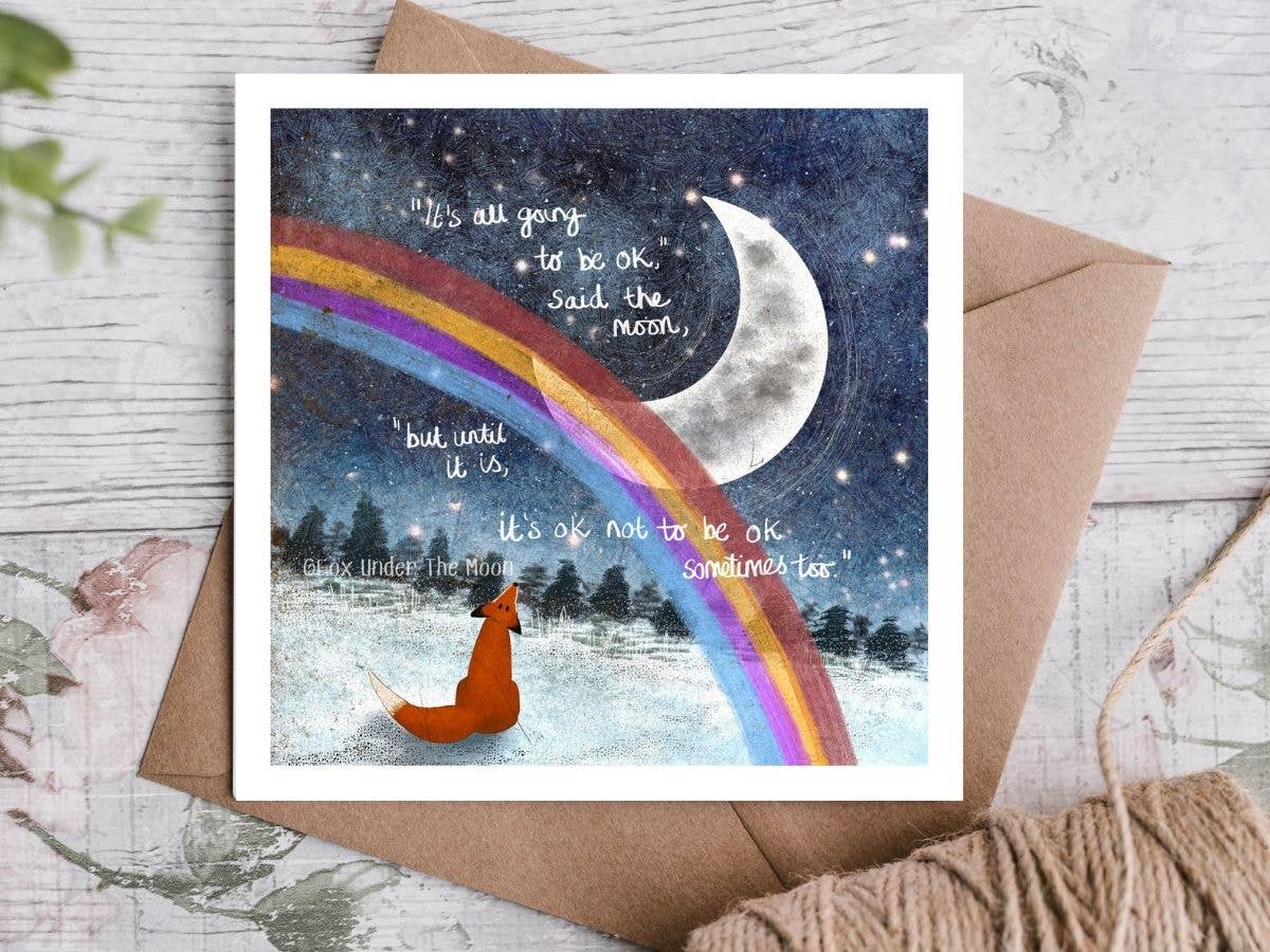 Greeting card with a fox, rainbow, and moon on a snowy night, with text.