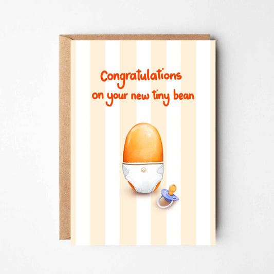 Greeting card with a baby pacifier and egg illustration on a striped background
