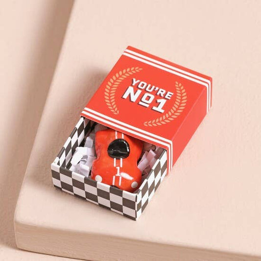 Red racing car token with 'You're No.1' text in a checkered box on a beige background