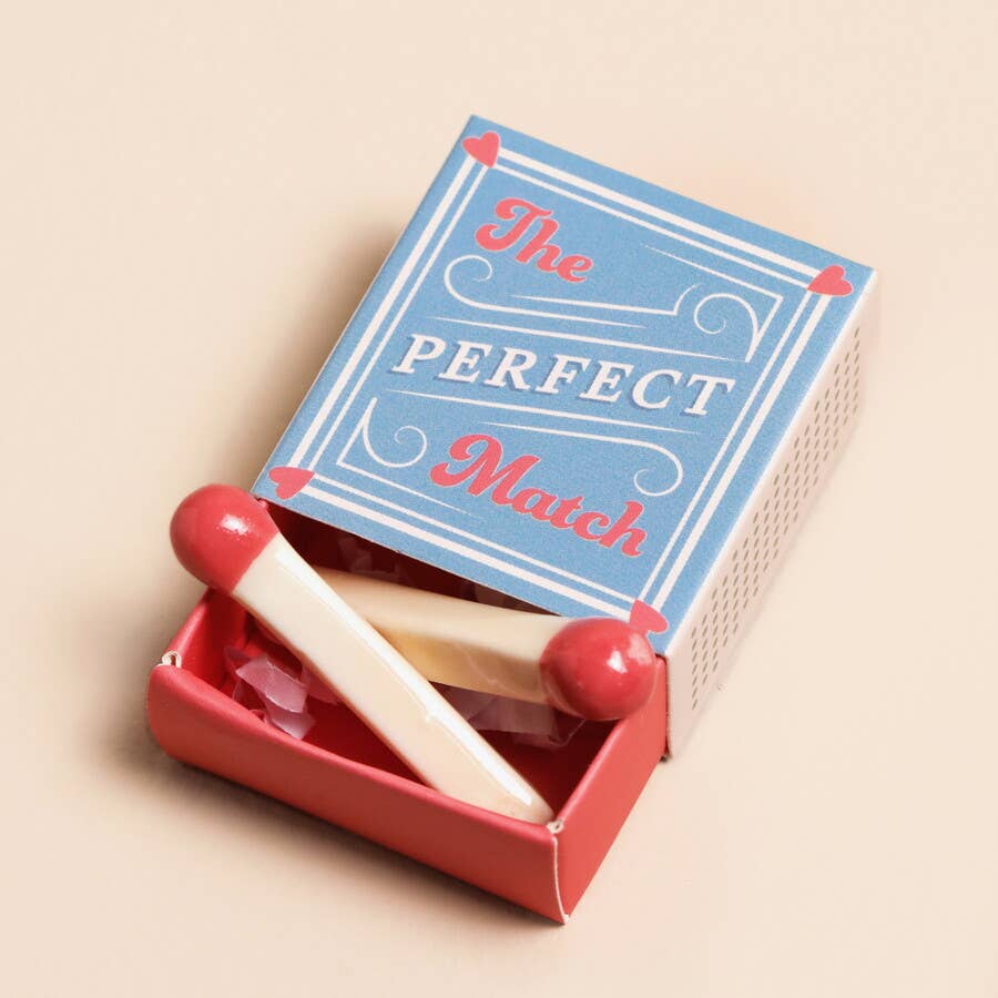Matchbox with 'The Perfect Match' text on a beige background