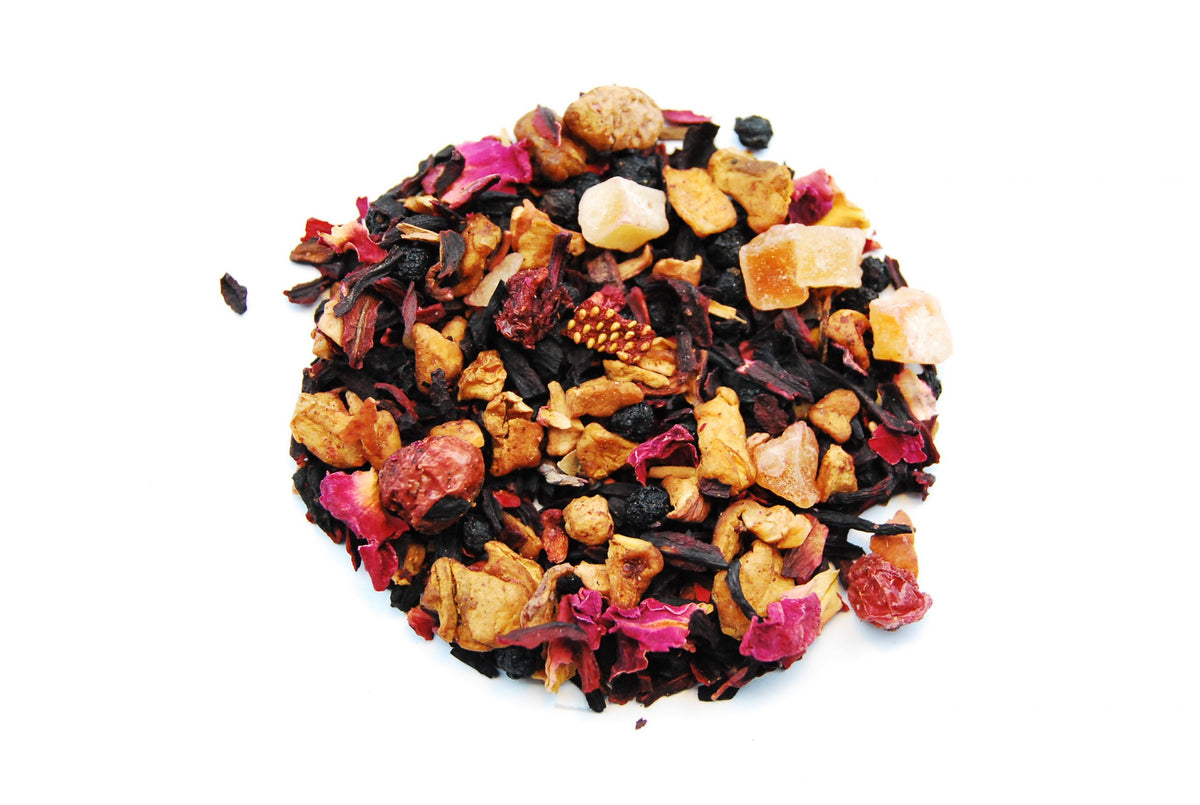 Loose Magic Tea fruit infusion with dried apple, hibiscus and berry pieces on a white background