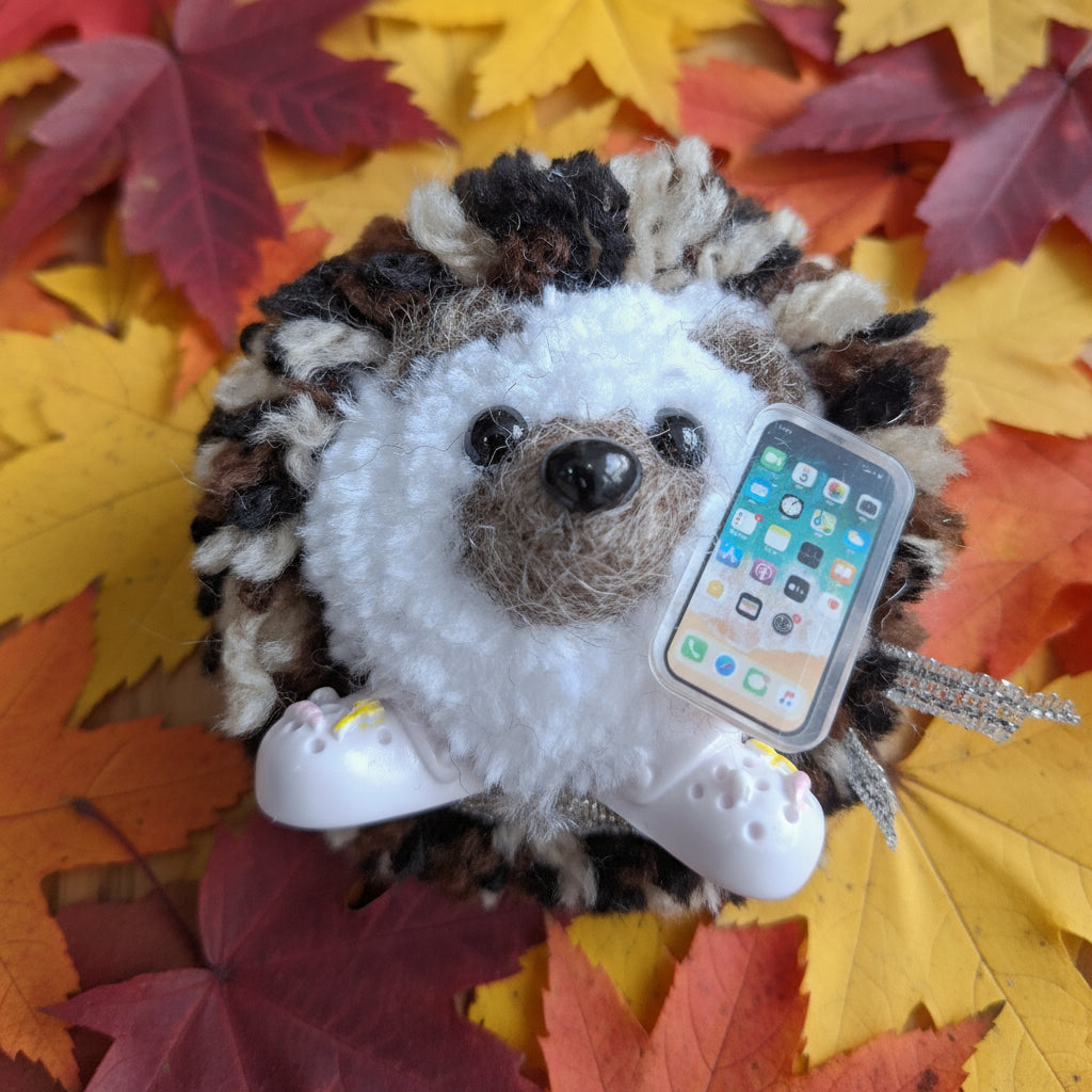 Hedgehog ornament with a smartphone and crocs 