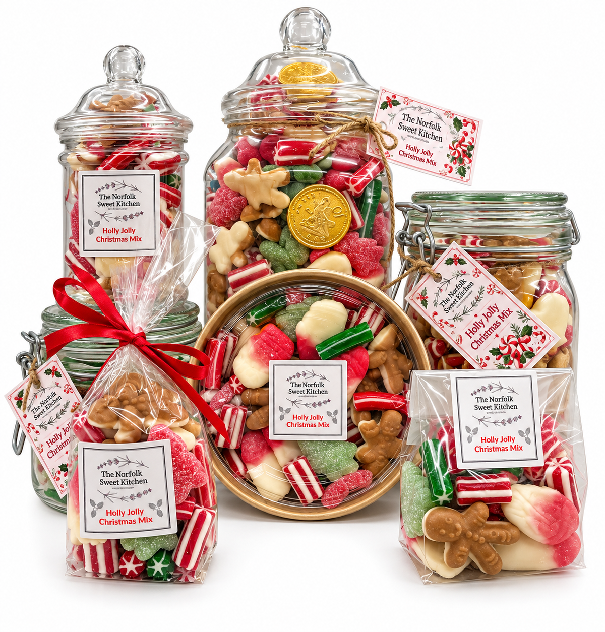 The Norfolk Sweet Kitchen Holly Jolly Christmas sweet mix range in assorted jars, bags and a tub