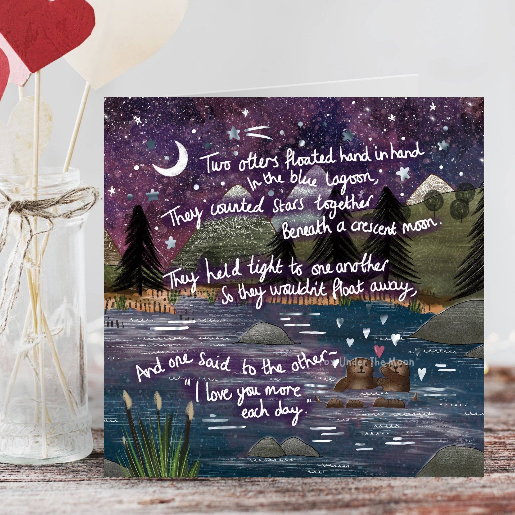 Framed artwork with a romantic poem and illustration of two bears by a lake under a starry sky.