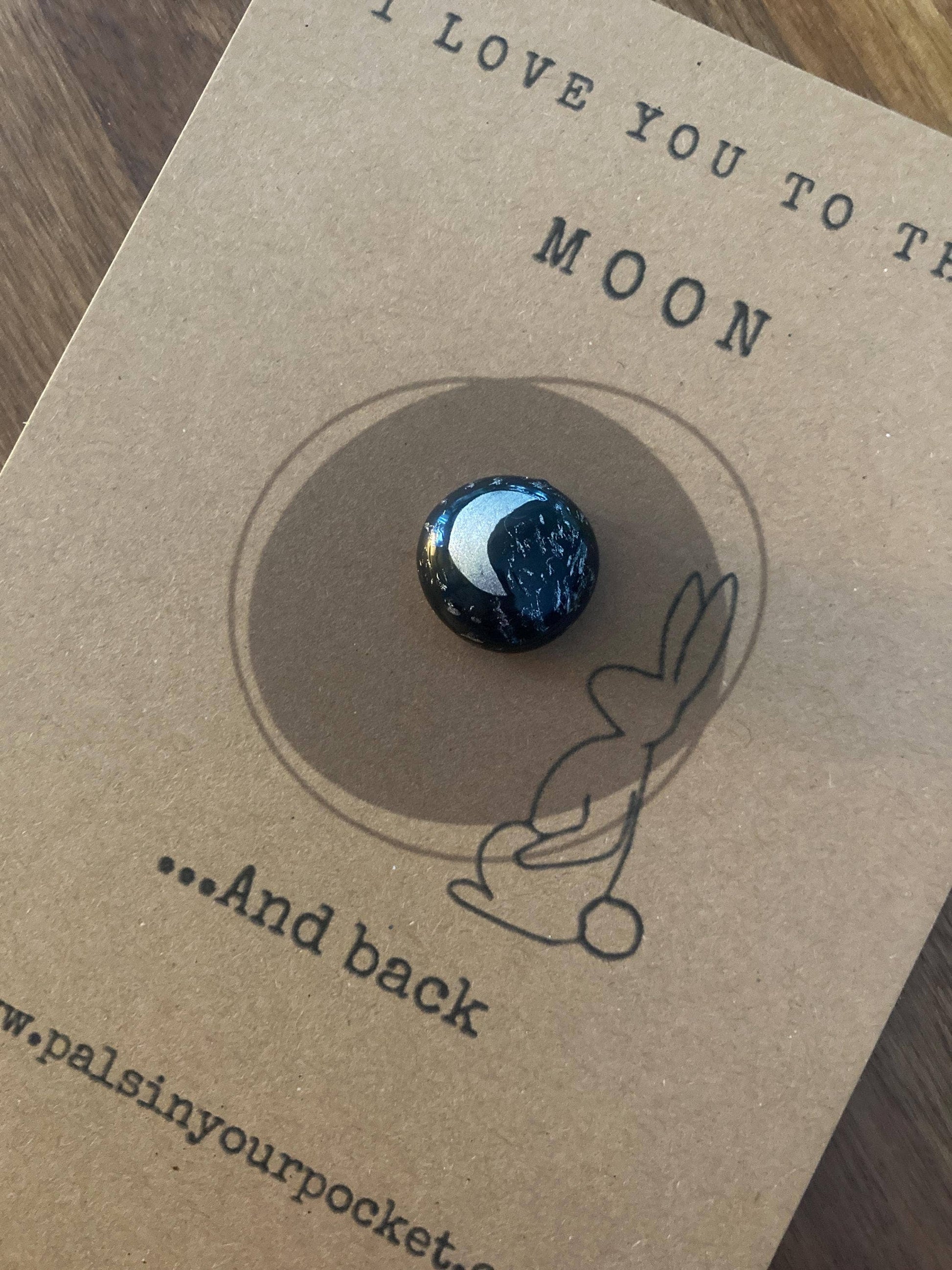 Pebble with moon design on a 'I love you to the moon and back' card