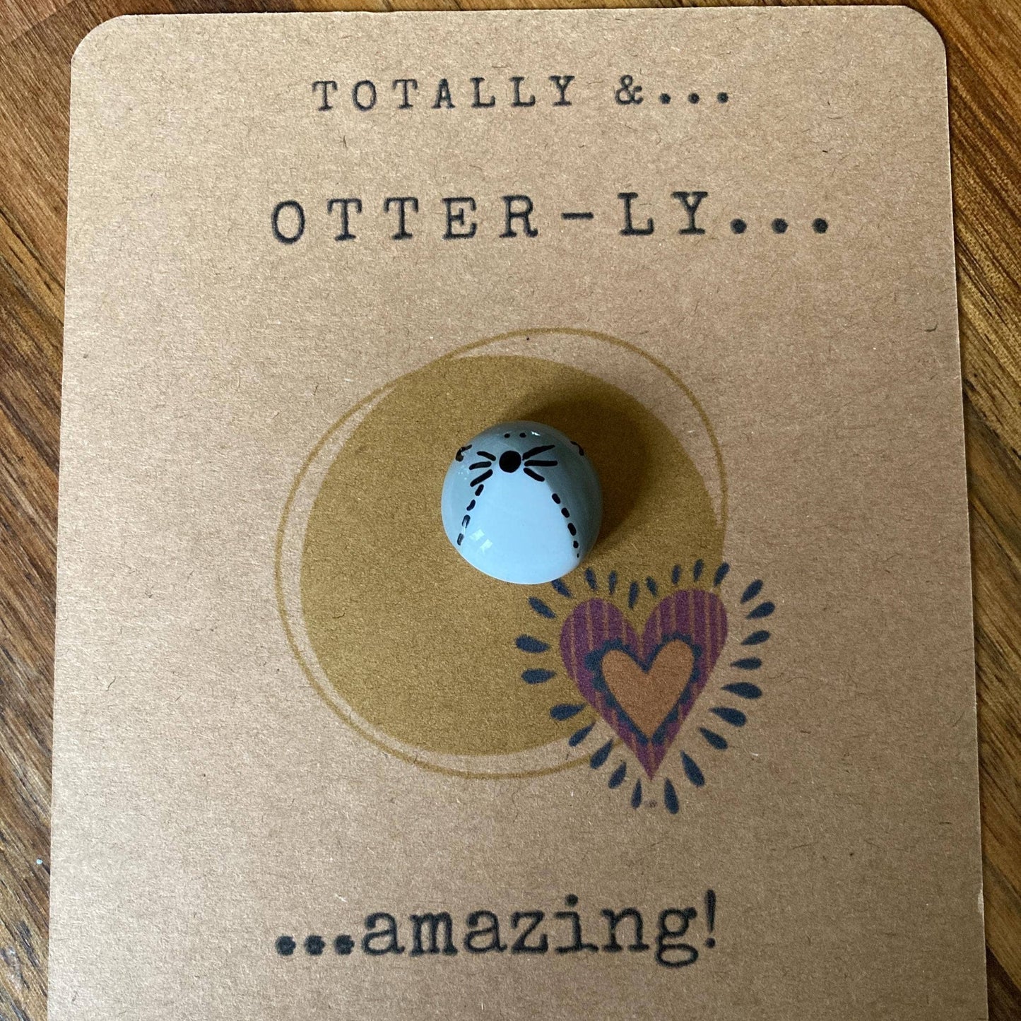 Tokenon a kraft paper card with text and a heart design