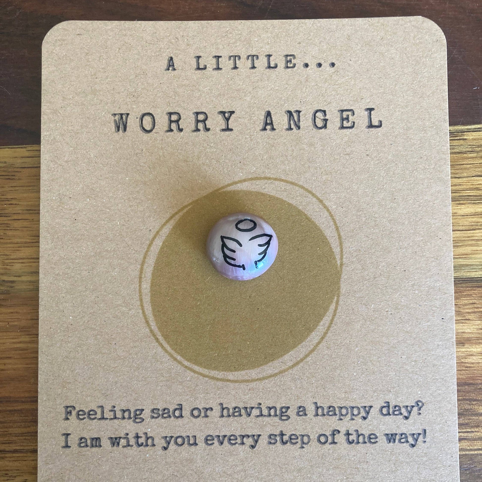 Worry bead on a card with text 