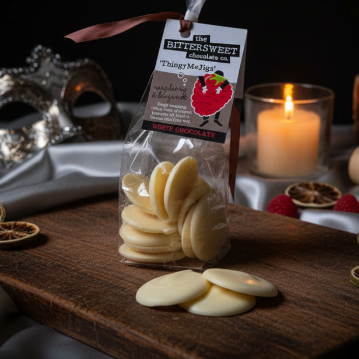 Raspberry & Bergamot White Chocolate Thingy Me Jigs - elegant white chocolate disks infused with raspberry and Earl Grey bergamot oil, vegetarian and gluten-free artisan chocolate