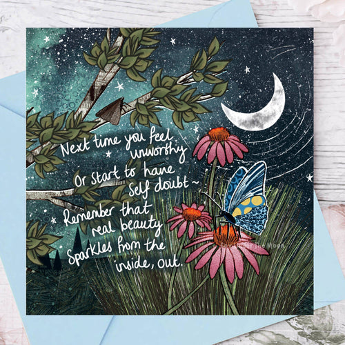 Greeting card with butterfly, flowers, and motivational quote against a night sky background.