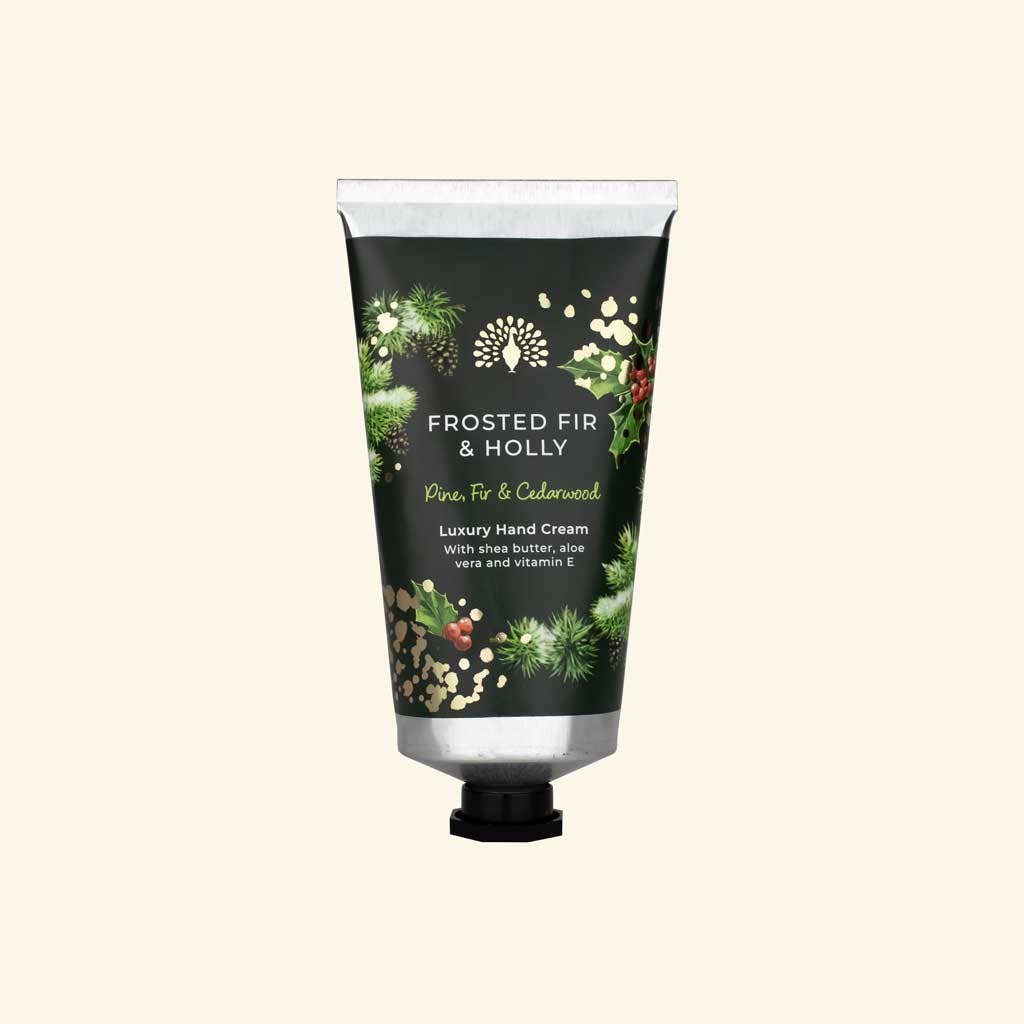 Hand cream tube labeled 'Frosted Fir & Holly' on a white background