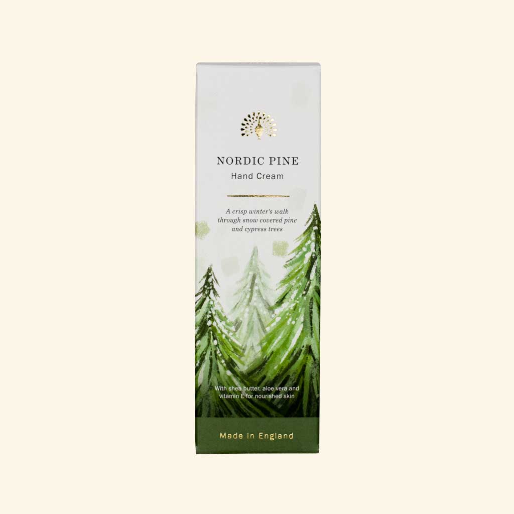 Nordic Pine hand cream packaging with green trees on a white background