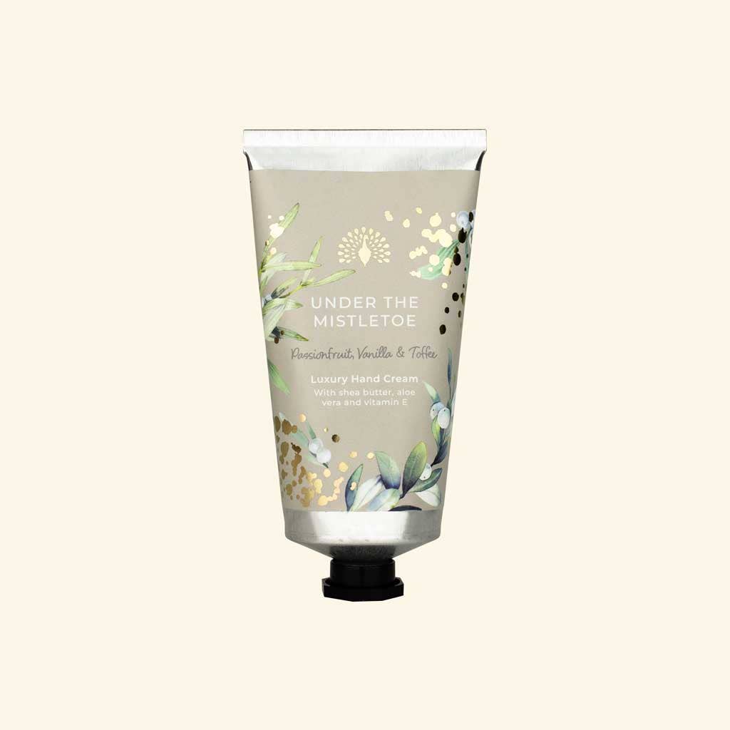 Hand cream tube with floral design on a white background