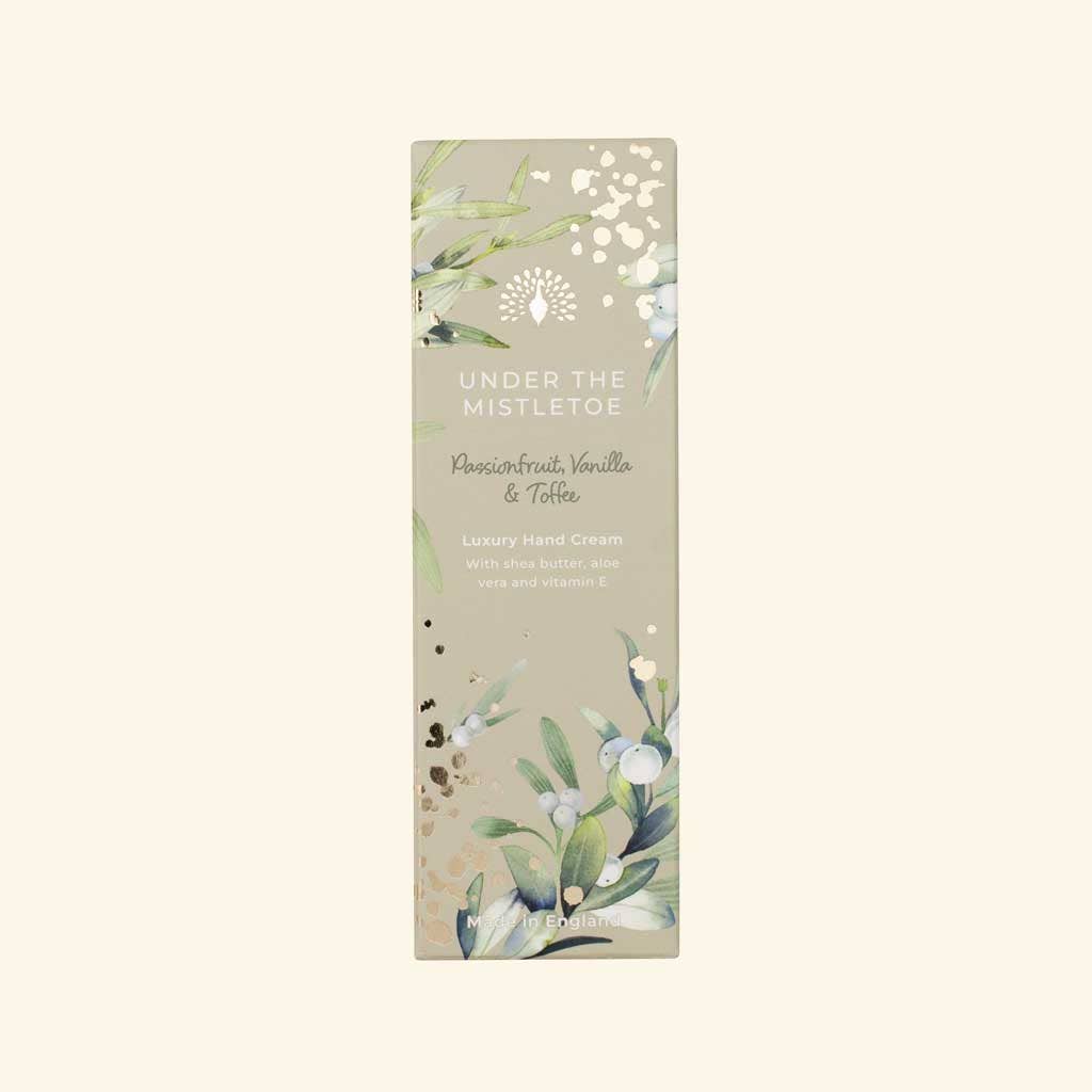 Christmas hand cream with floral design and text on a seasonal background, smells of passionfruit, vanilla and toffee
