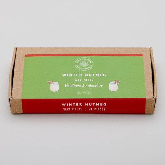 Box of winter nutmeg wax melts with a green label on a white background